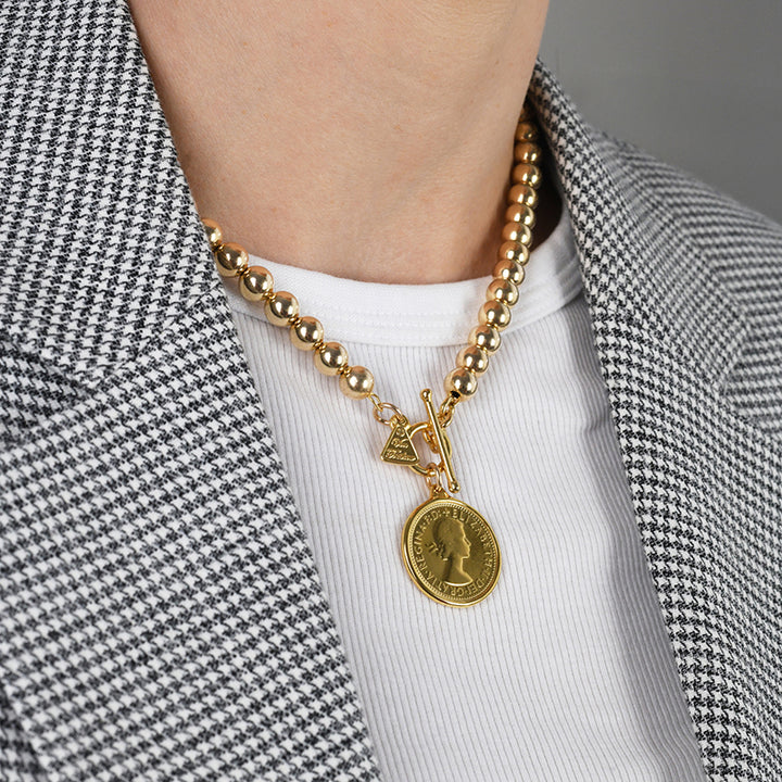 BEADED NECKLACE WITH SHILLING