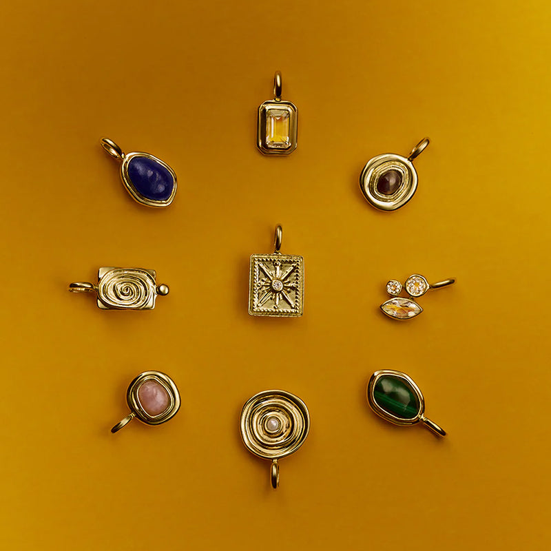 UNBOUND WHITE TOPAZ CHARM