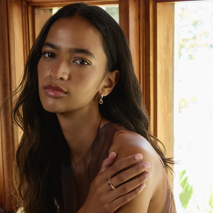 SOLACE GARNET HUGGIE EARRING