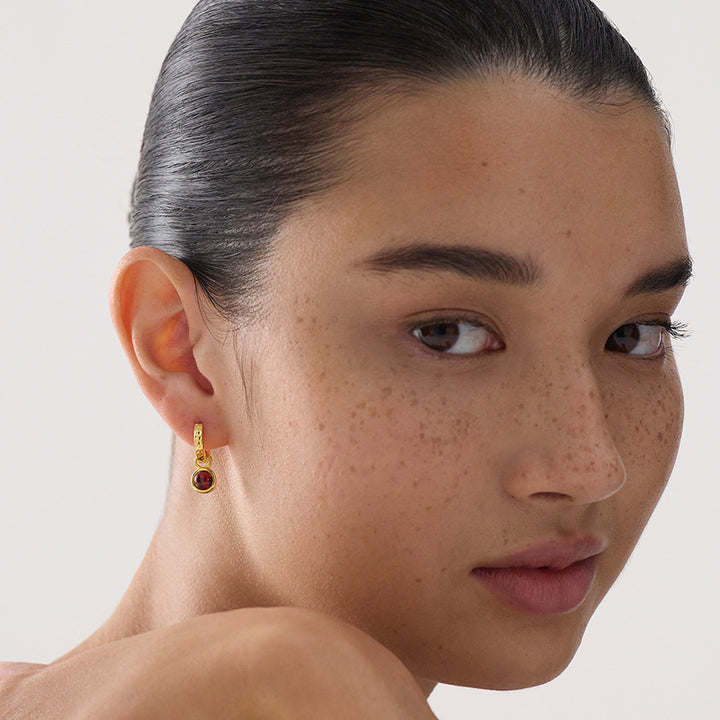 SOLACE GARNET HUGGIE EARRING