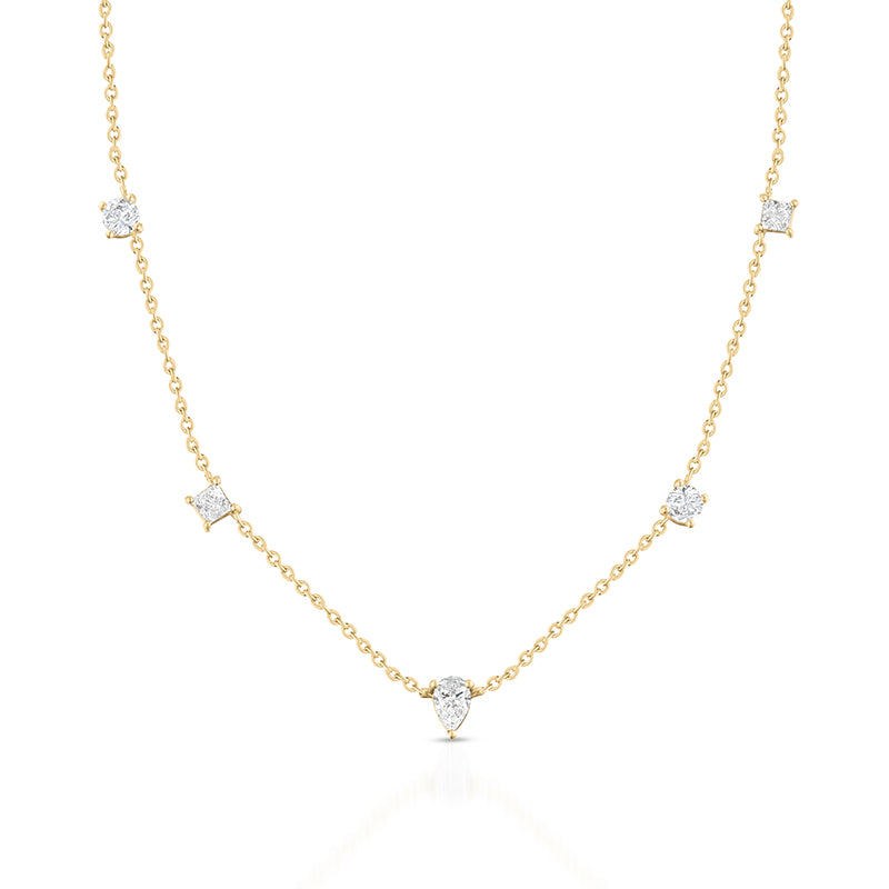 A delicate yellow gold necklace featuring five pear-cut diamond settings spaced along the chain, displayed on a clean white background with a soft reflection.