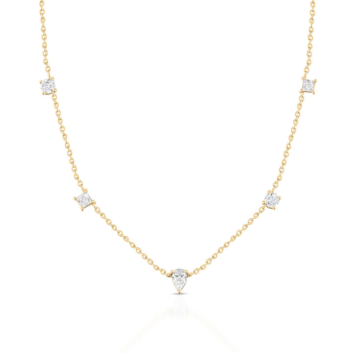 A delicate yellow gold necklace featuring five pear-cut diamond settings spaced along the chain, displayed on a clean white background with a soft reflection.