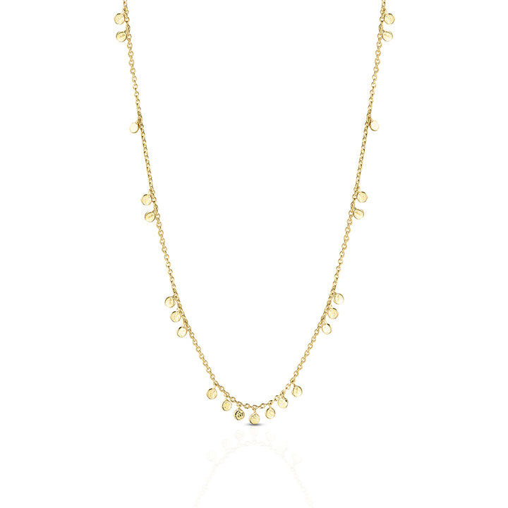 A delicate gold chain necklace featuring multiple small, flat circular disc charms in varying sizes, displayed against a clean white background.
