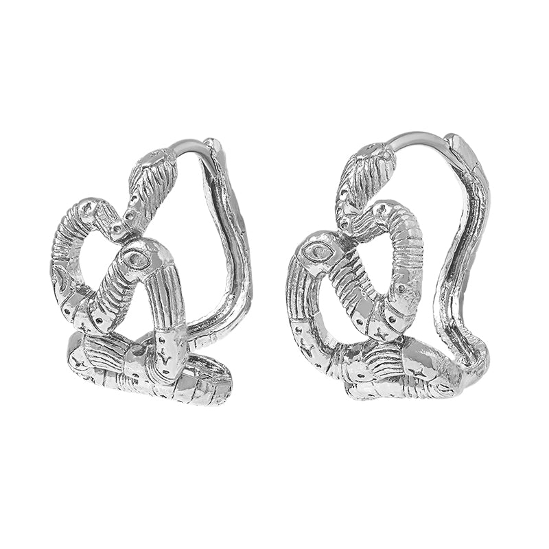 A pair of textured sterling silver huggie hoop earrings with a coiled snake design, shown on a plain white background.