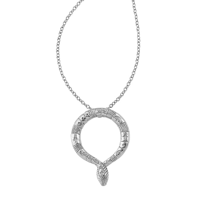 A silver-toned snake pendant necklace with detailed engravings and a textured head, suspended on a delicate link chain against a plain white background.